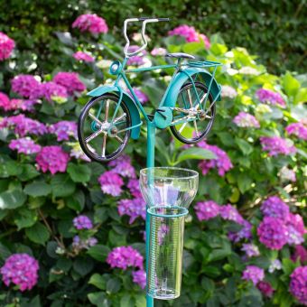 Regenmesser mit Fahrrad türkis